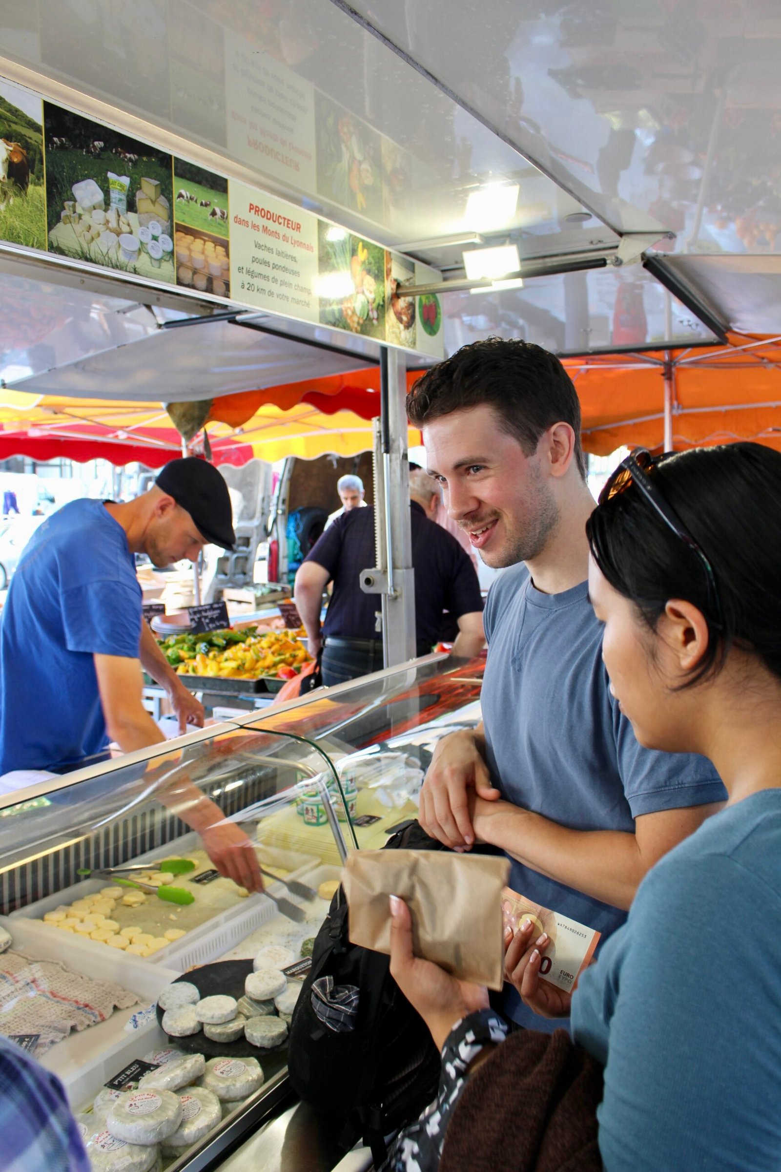 Matt with a guest at the Lyon market