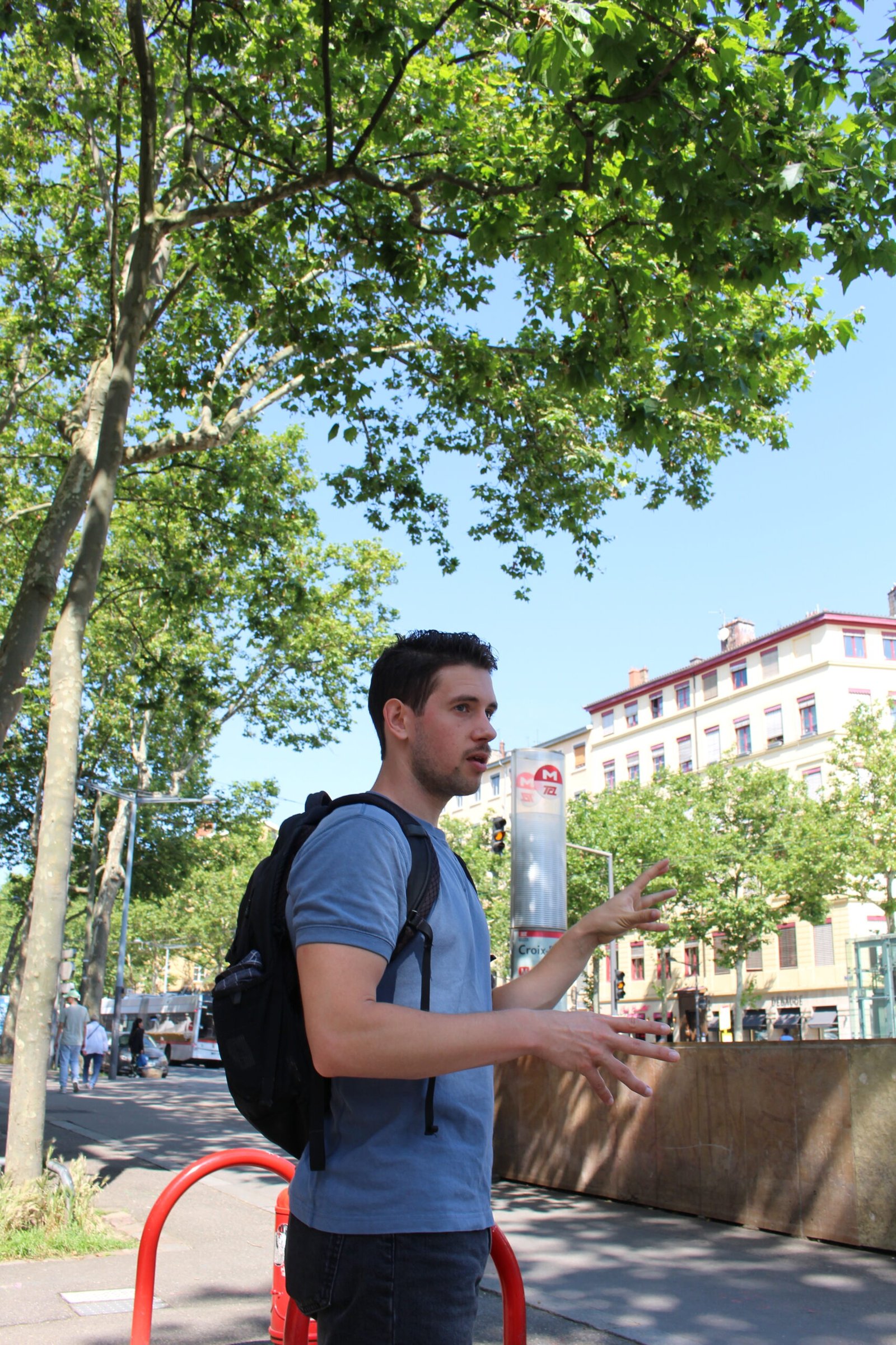 Matt at Croix-Rousse metro explaining the neighborhood